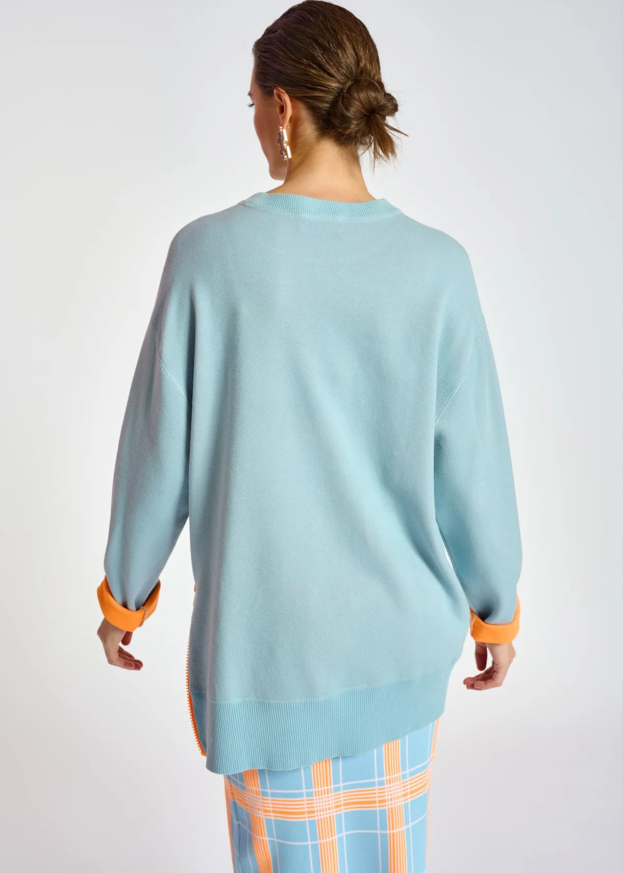 Light blue sweater with boxy cut