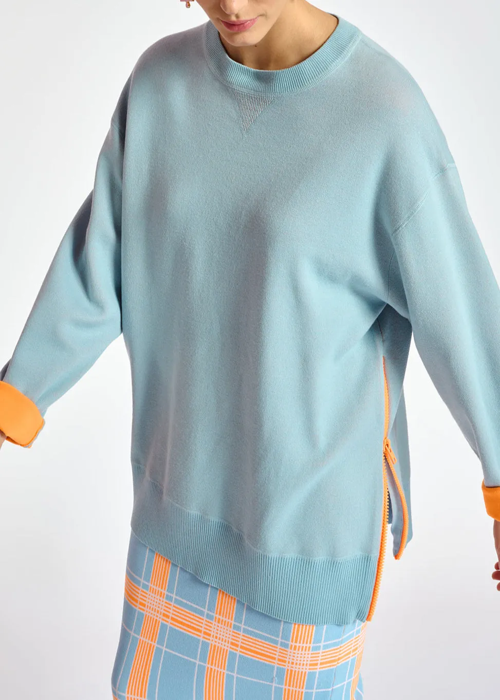 Light blue sweater with boxy cut