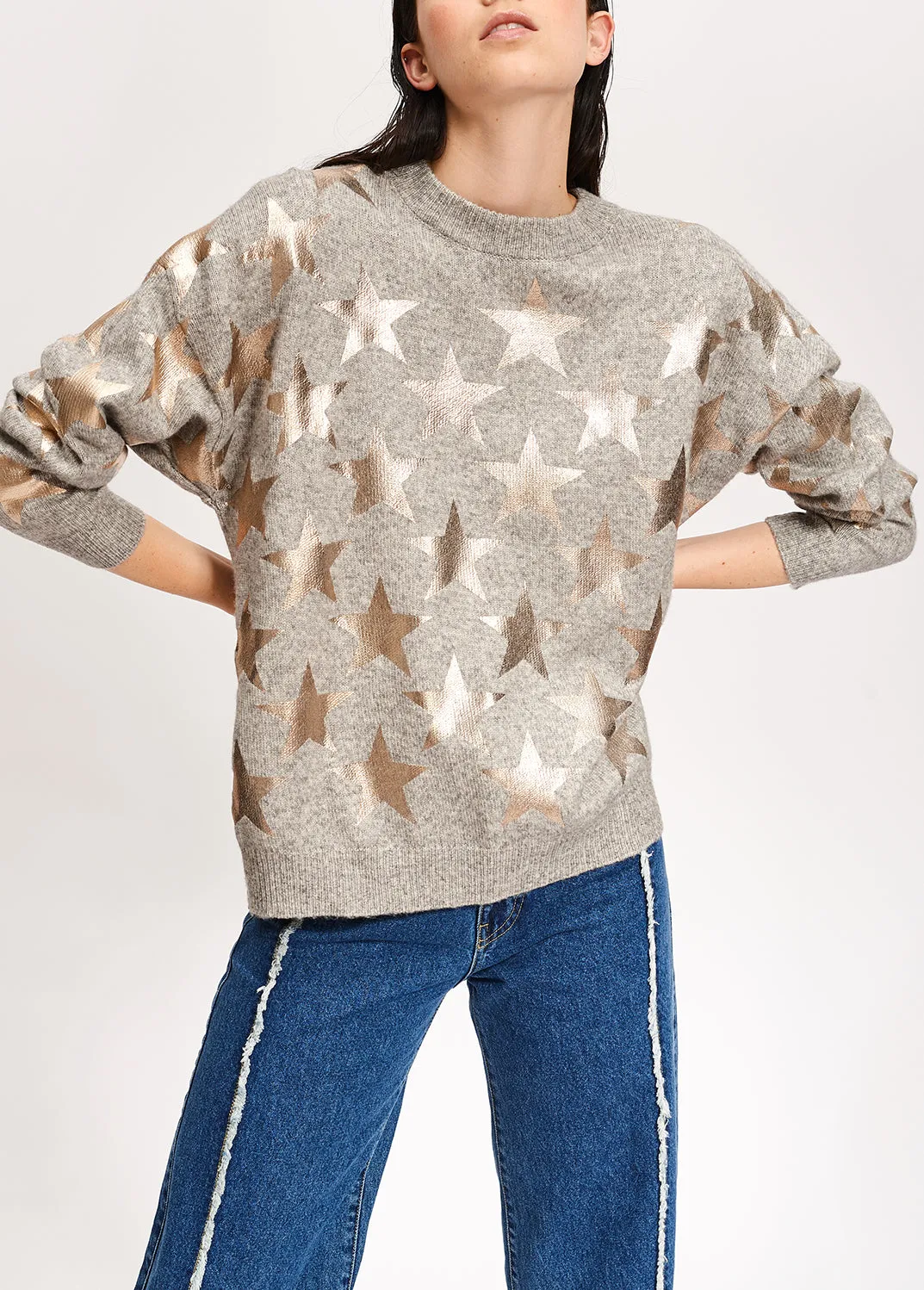 Light grey knitted sweater with metallic stars