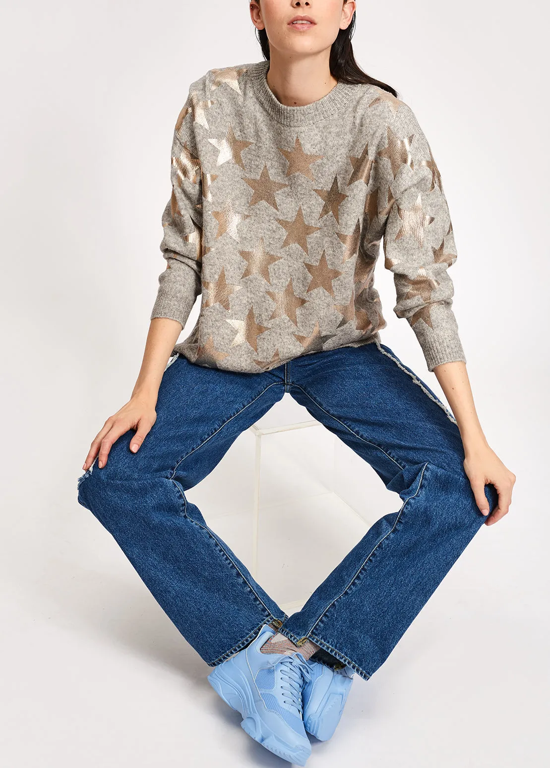 Light grey knitted sweater with metallic stars