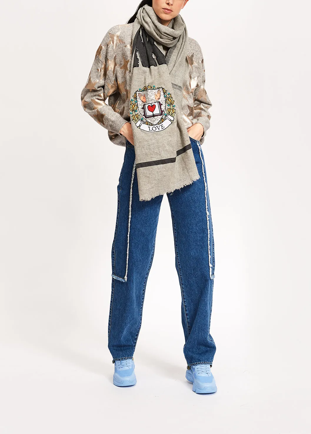 Light grey knitted sweater with metallic stars