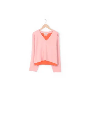 Light pink v-neck sweater with orange contrast